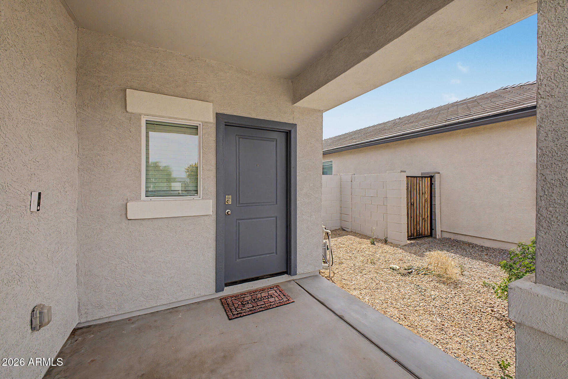 9345 Tangerine Road Florence, AZ 85132 - Photo 4 of 30 a bedroom with a bed and a window