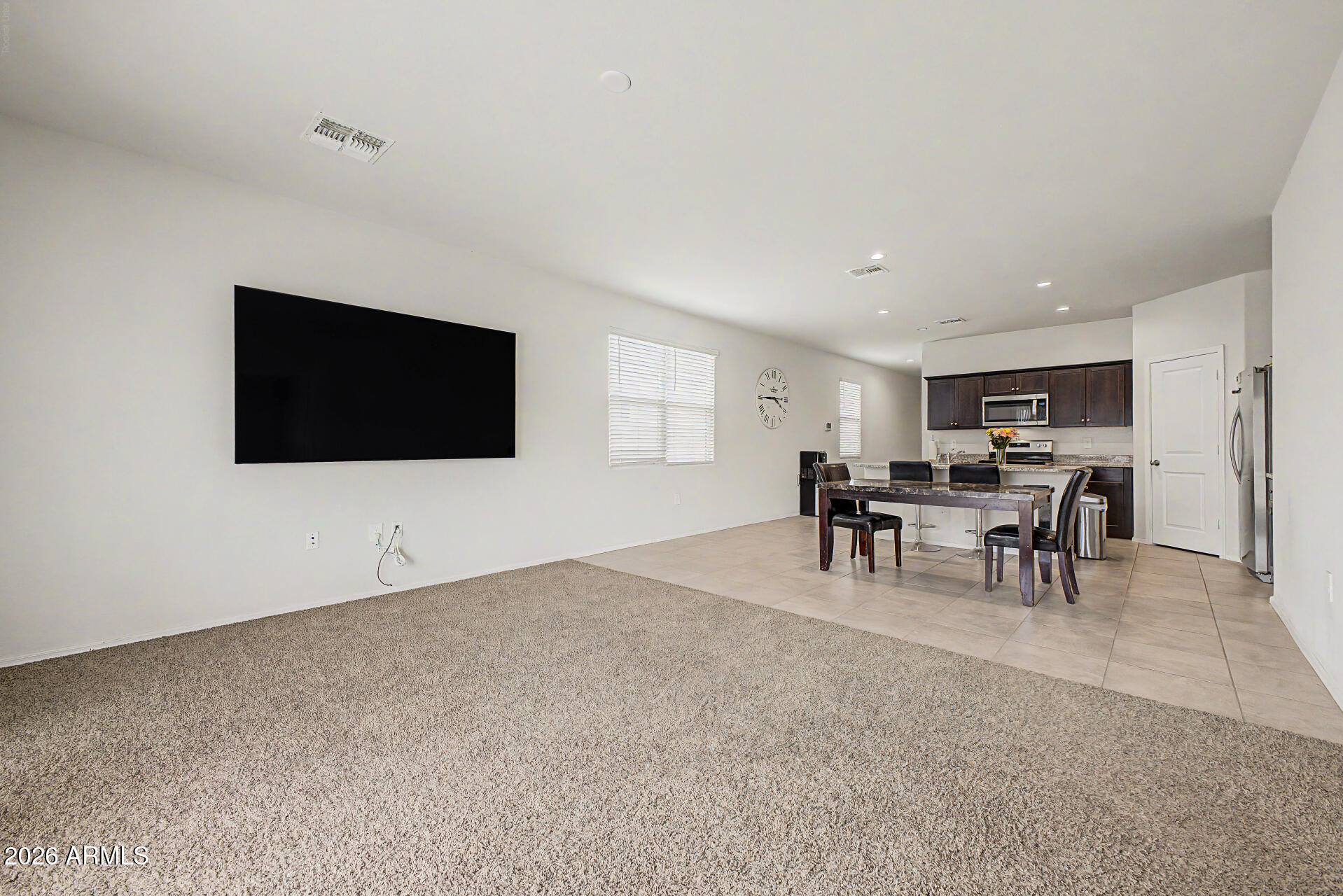 9345 Tangerine Road Florence, AZ 85132 - Photo 10 of 30 a view of a livingroom with furniture and a flat screen tv