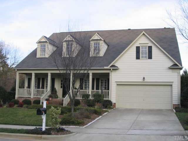 9120 Breeland Way Raleigh, NC 27613 - Photo 1 of 1 a view of a white house with large windows next to a yard