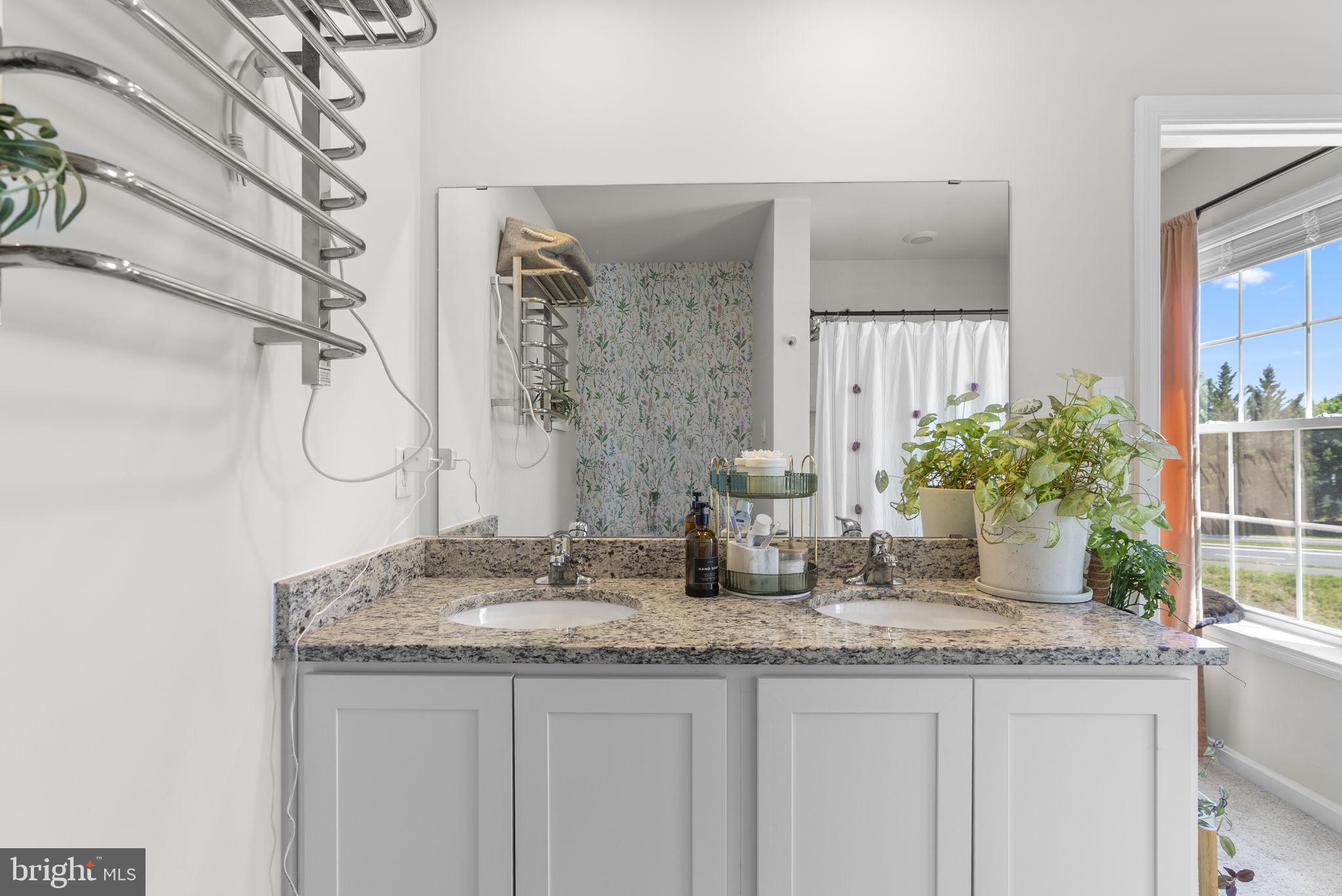8656 Walter Martz Road Frederick, MD 21702 - Photo 21 of 30 a bathroom with a granite countertop sink and a mirror