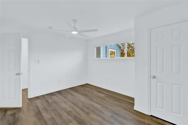 a large kitchen with a center island and stainless steel appliances