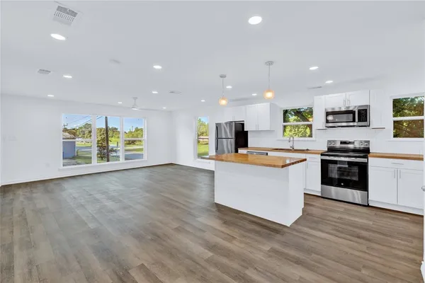 a picture of a bench in front of a wall