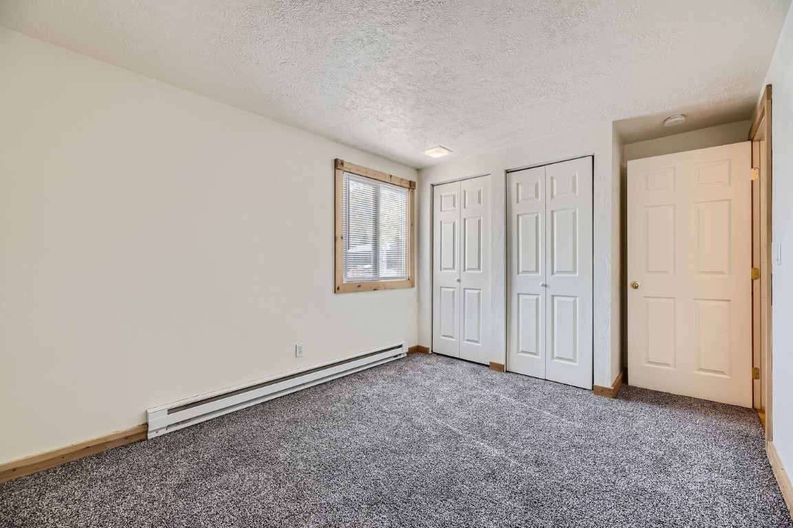 707 Frisco Street, Unit 45 Frisco, CO 80443 - Photo 14 of 18 an empty room with a empty space and windows