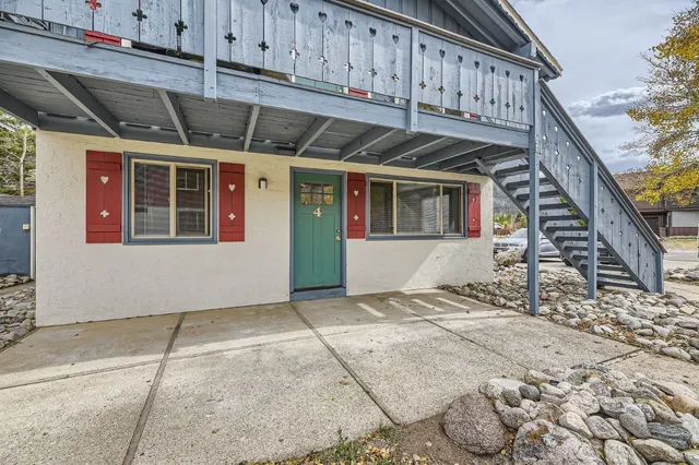a view of a house with wooden stairs
