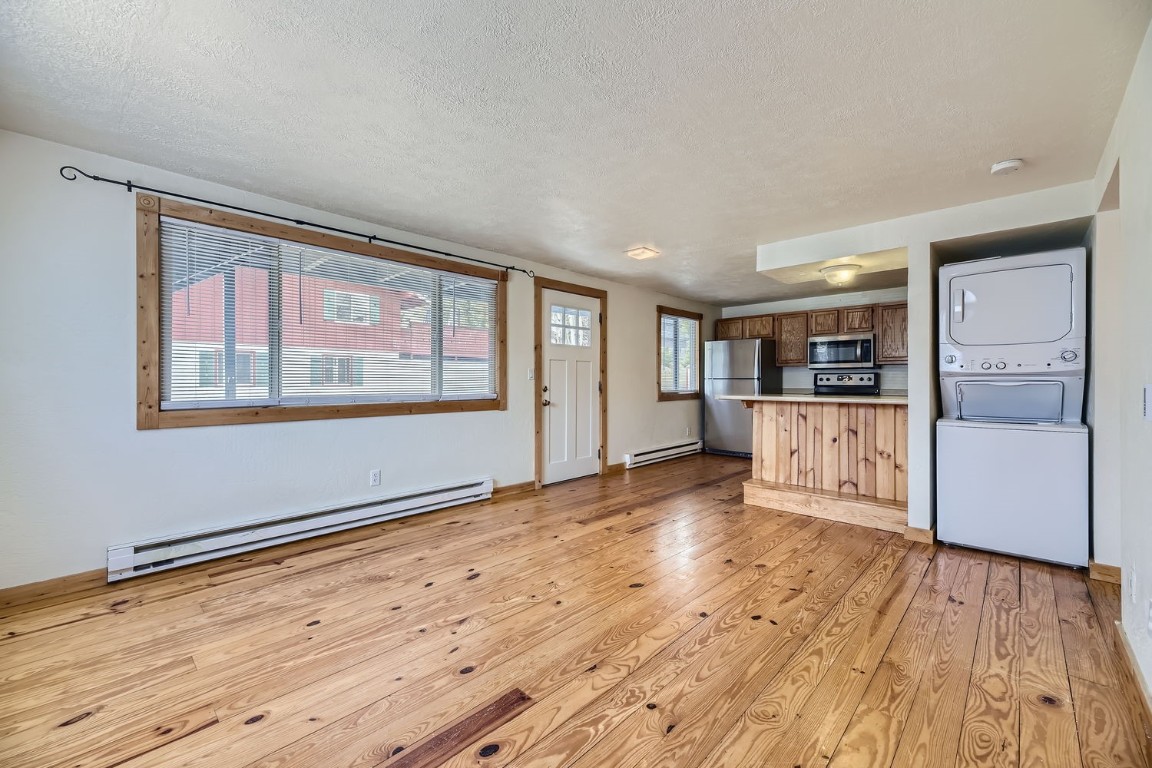 707 Frisco Street, Unit 45 Frisco, CO 80443 - Photo 7 of 18 a view of a kitchen with wooden floor and windows