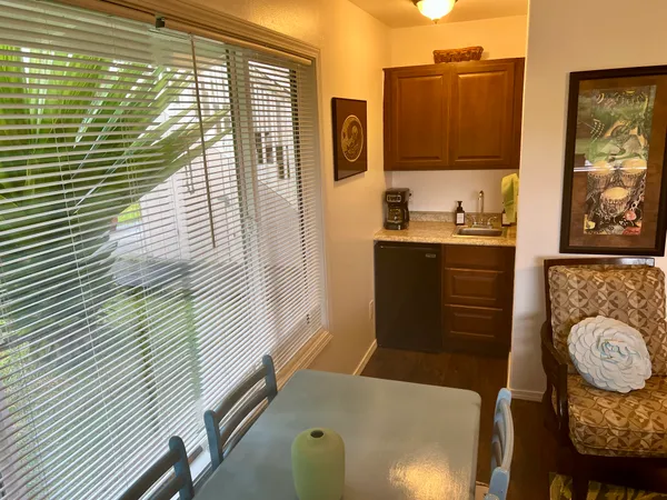 a balcony with table and chairs