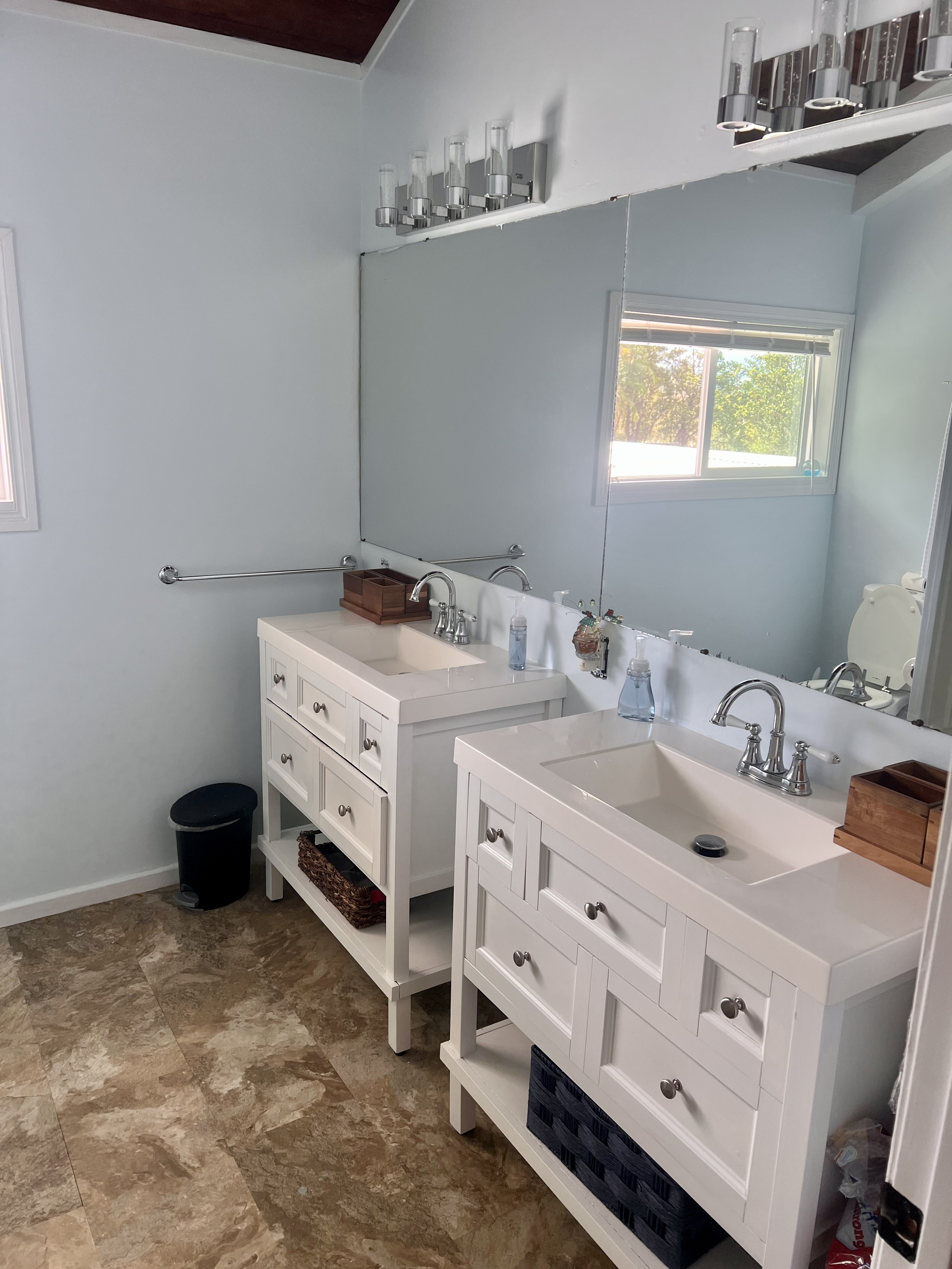 11-2485 Omeka Road Mountain View, HI 96771 - Photo 19 of 30 a bathroom with a double vanity sink and mirror