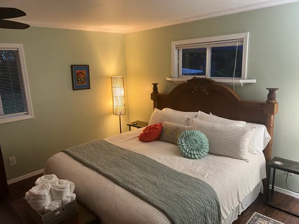 a bedroom with a bed and window