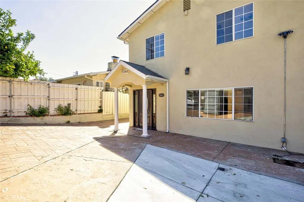 7044 Greeley Street Tujunga, CA 91042 - Photo 3 of 27 a front view of a house with a yard