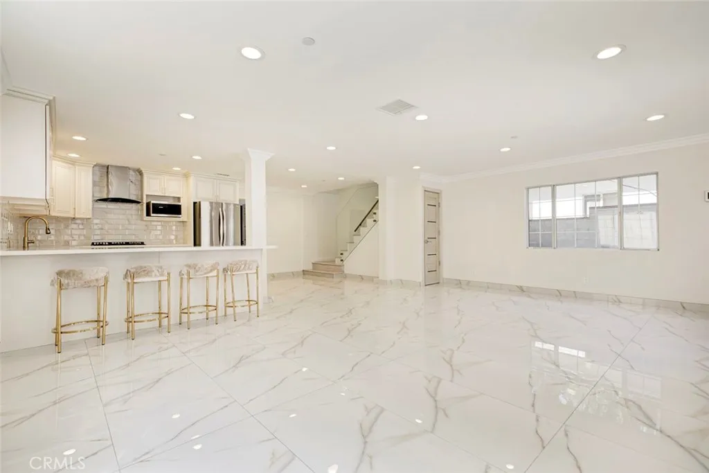 7044 Greeley Street Tujunga, CA 91042 - Photo 5 of 27 a view of kitchen with stainless steel appliances refrigerator oven and cabinets