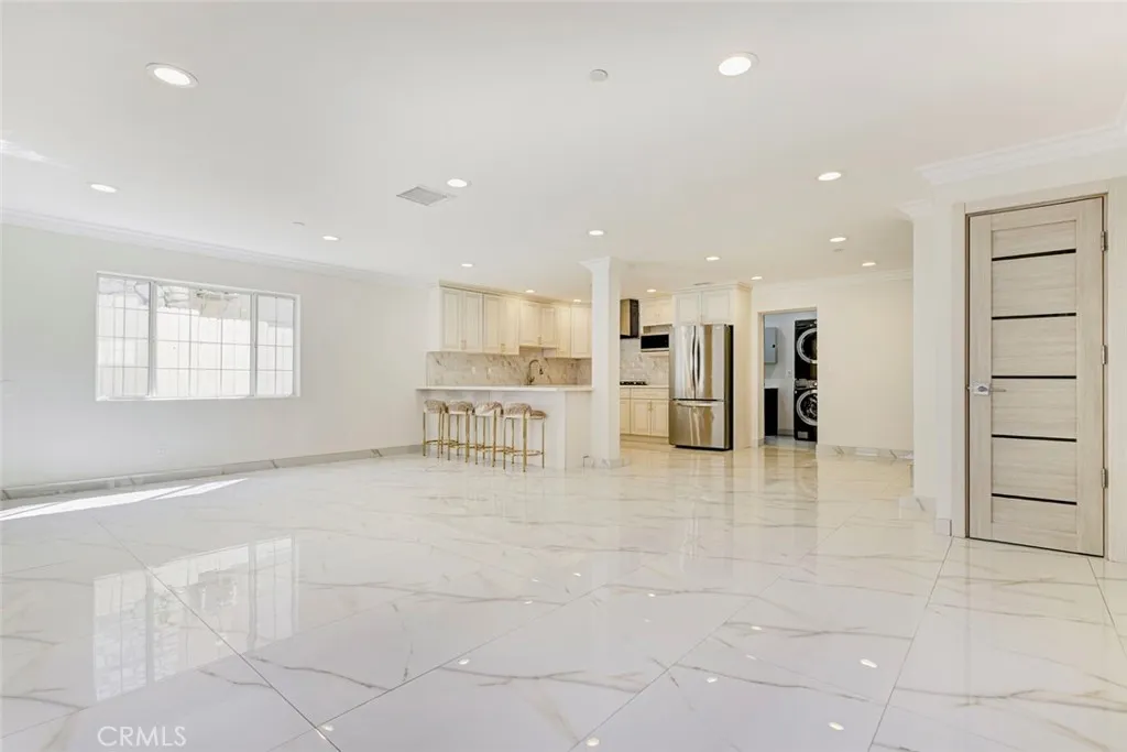 7044 Greeley Street Tujunga, CA 91042 - Photo 7 of 27 a view of a kitchen with a refrigerator and a counter top space