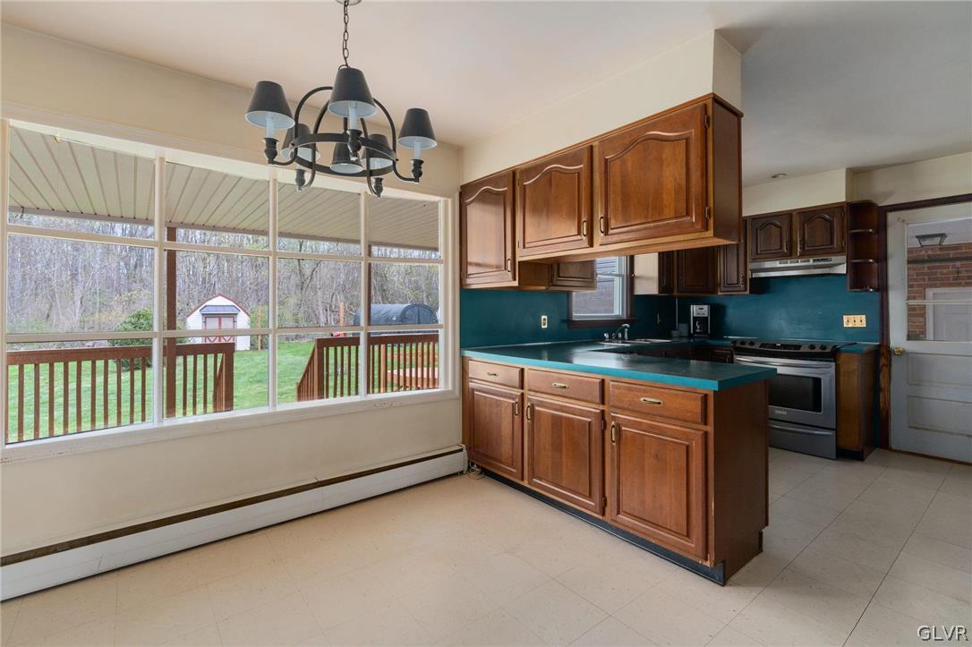 1675 Salem Road Quakertown, PA 18951 - Photo 18 of 34 a kitchen that has a lot of cabinets and a wooden floor