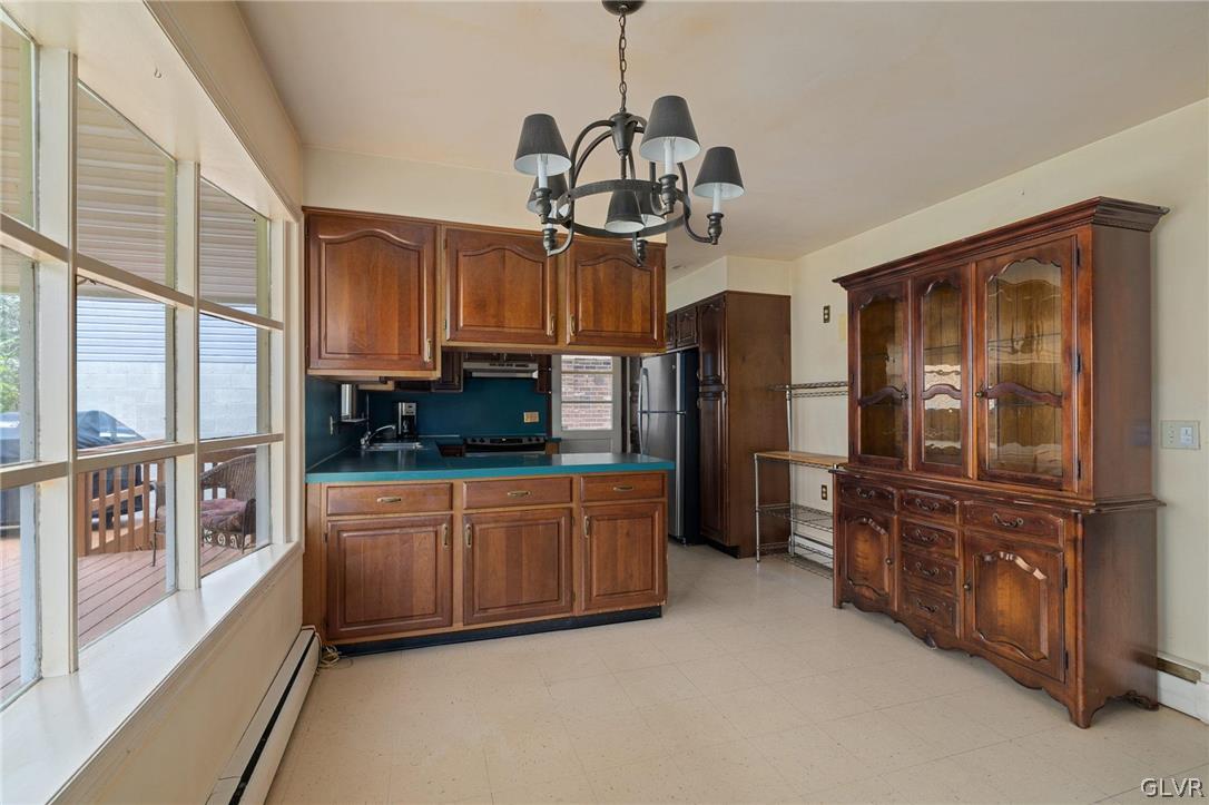 1675 Salem Road Quakertown, PA 18951 - Photo 19 of 34 a kitchen with stainless steel appliances granite countertop a refrigerator and microwave