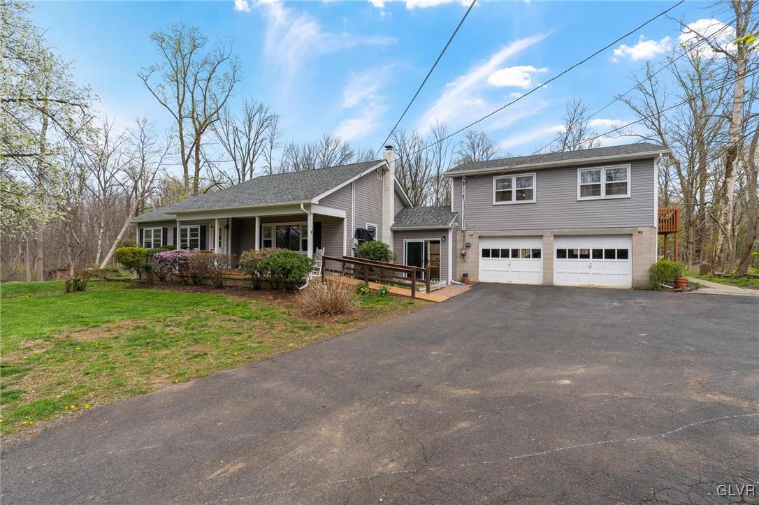 1675 Salem Road Quakertown, PA 18951 - Photo 2 of 34 a view of a house with a yard and large tree