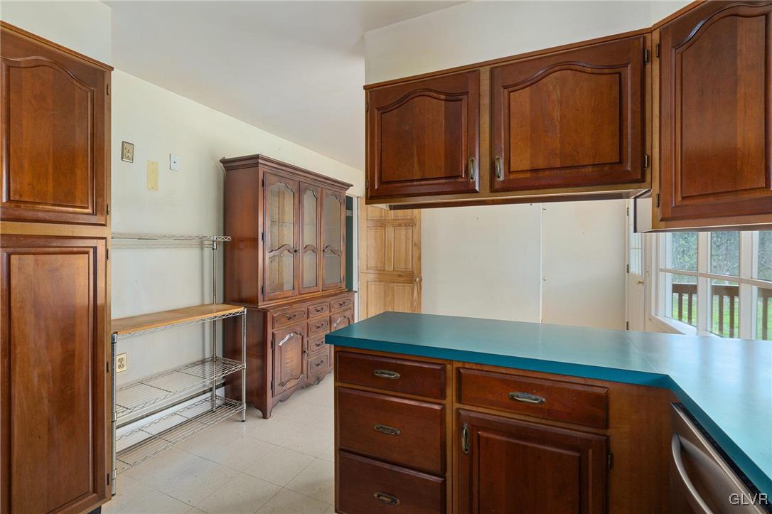 1675 Salem Road Quakertown, PA 18951 - Photo 23 of 34 a kitchen with stainless steel appliances granite countertop a refrigerator and cabinets