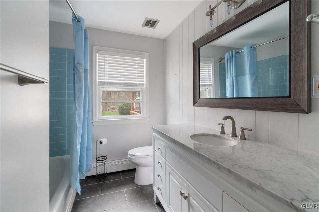 1675 Salem Road Quakertown, PA 18951 - Photo 27 of 34 a bathroom with a granite countertop toilet sink and mirror