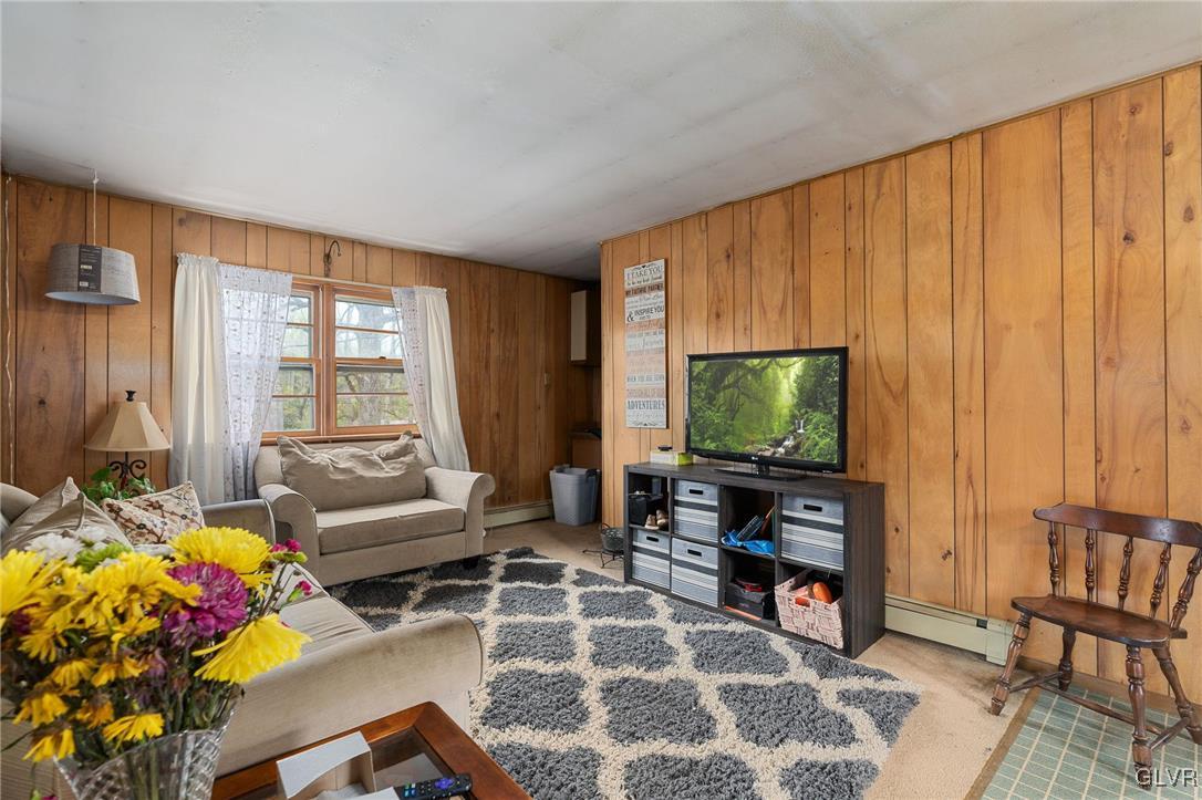 1675 Salem Road Quakertown, PA 18951 - Photo 34 of 34 a living room with furniture and a flat screen tv