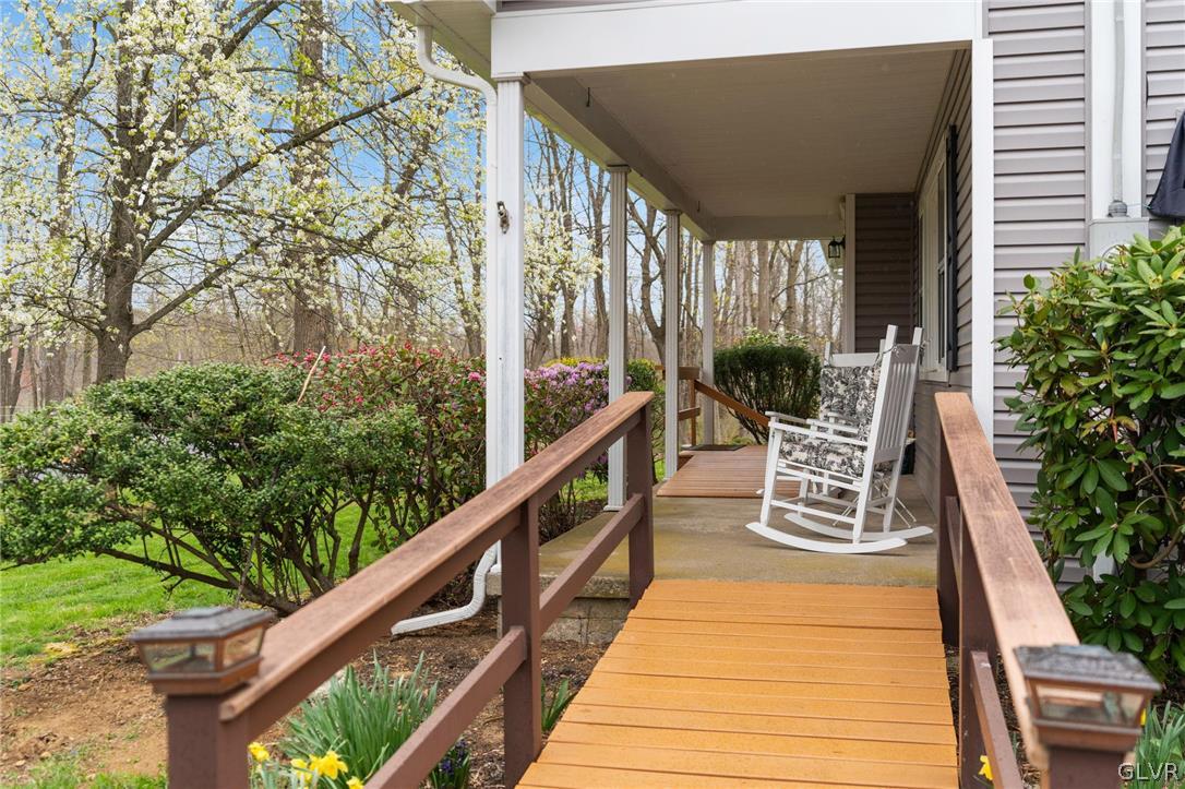 1675 Salem Road Quakertown, PA 18951 - Photo 8 of 34 a balcony with wooden floor and outdoor seating