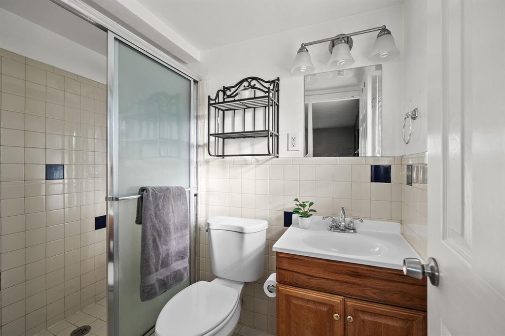 10 Estates Road Lucas, TX 75002 - Photo 20 of 39 Full bath with vanity, a shower stall, and tile walls