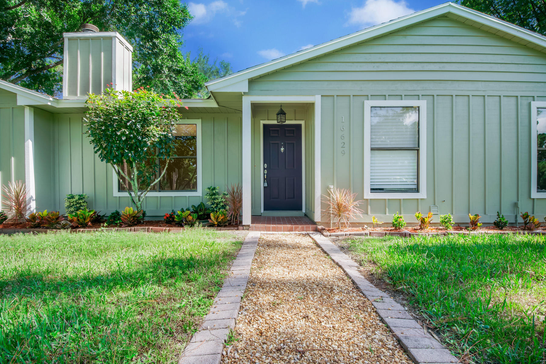 16629 93rd Road North Loxahatchee, FL 33470 - Photo 4 of 38 1 Exterior Front 4 LR1_5497-Edit