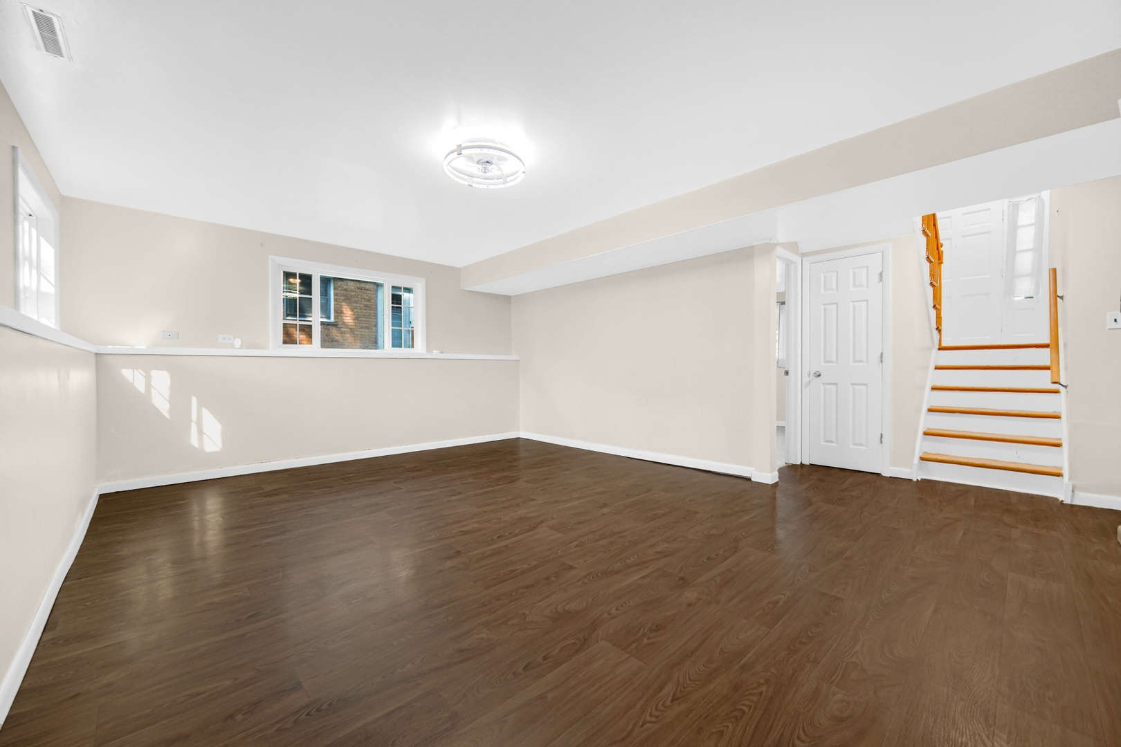 120 Indiana Street Park Forest, IL 60466 - Photo 15 of 25 an empty room with wooden floor and windows