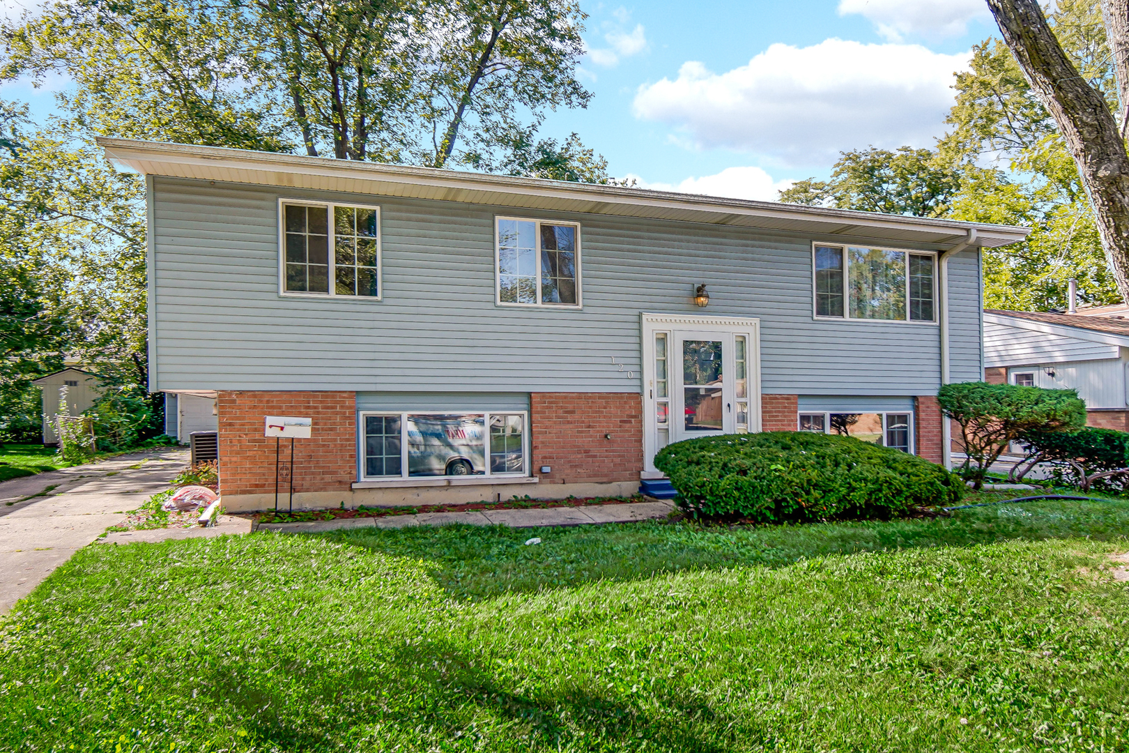 120 Indiana Street Park Forest, IL 60466 - Photo 2 of 25 a front view of a house with garden and yard