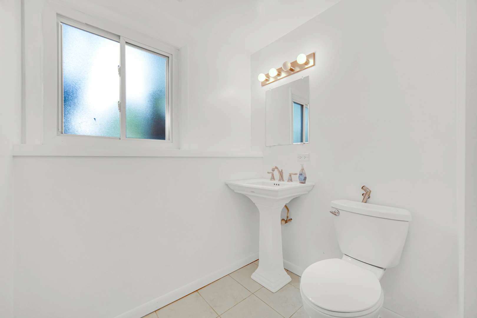 120 Indiana Street Park Forest, IL 60466 - Photo 21 of 25 a bathroom with a toilet sink and mirror