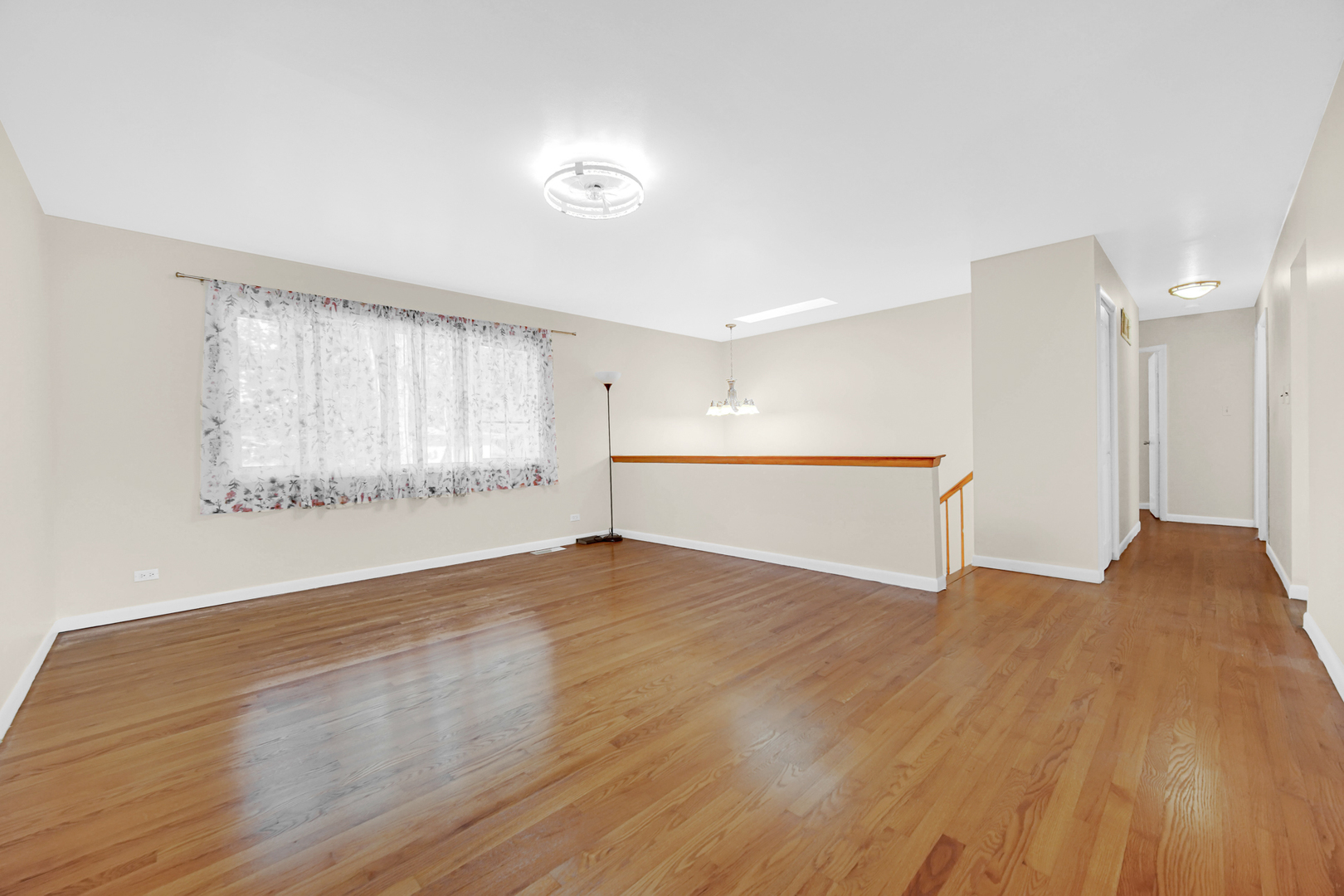 120 Indiana Street Park Forest, IL 60466 - Photo 4 of 25 a view of an empty room with wooden floor and a window