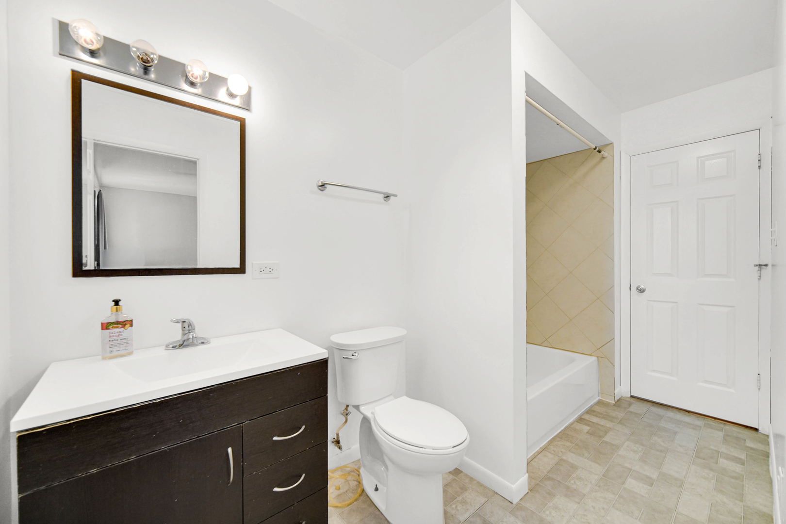 120 Indiana Street Park Forest, IL 60466 - Photo 10 of 25 a bathroom with a toilet sink vanity and mirror