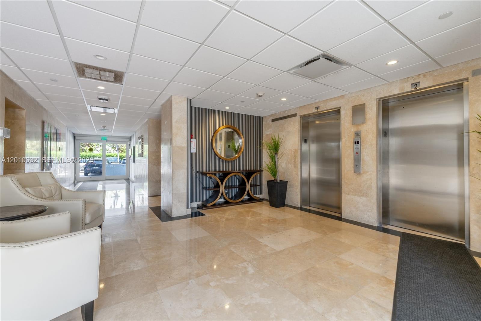 2639 North Riverside Drive, Unit 501 Pompano Beach, FL 33062 - Photo 39 of 39 a view of a livingroom with furniture and a large window