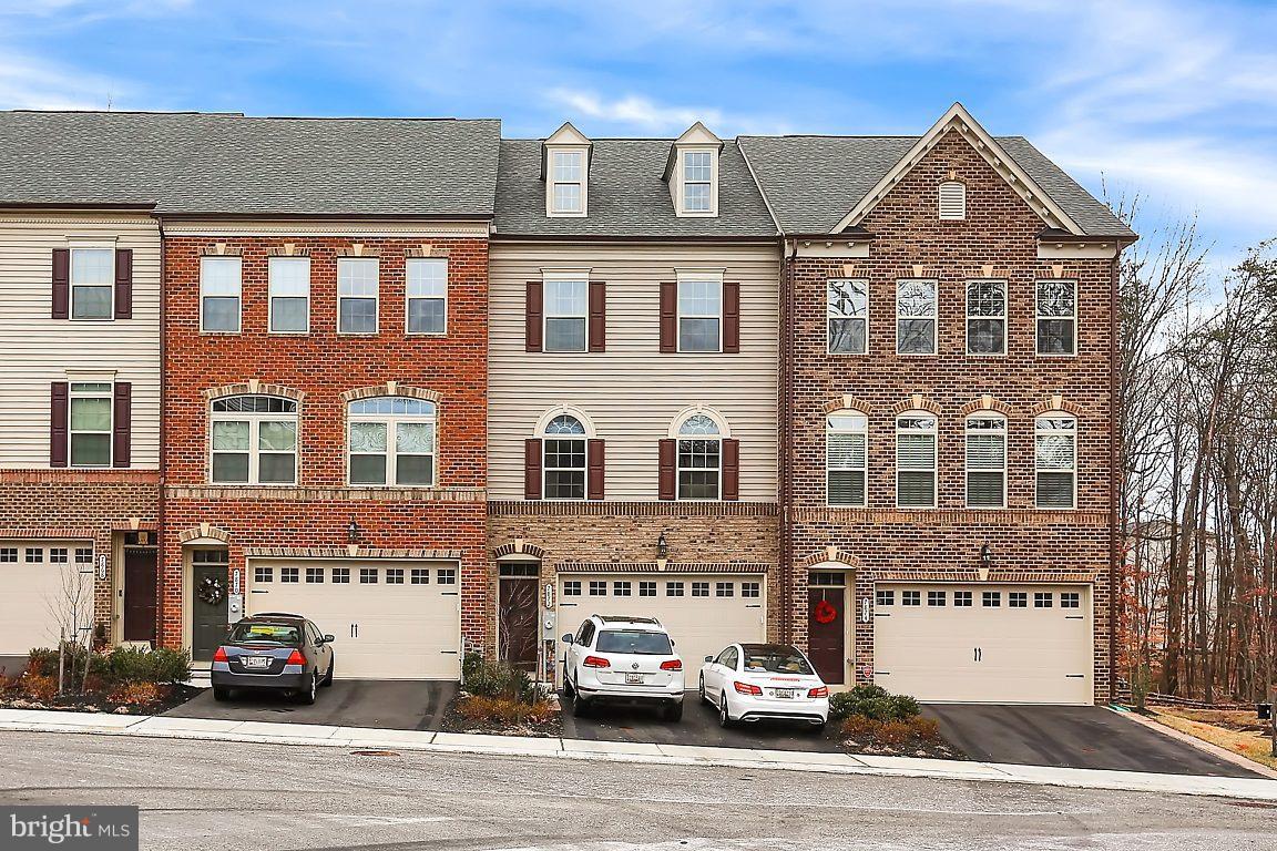 7872 Patterson Way Hanover, MD 21076 - Photo 2 of 26 a front view of a building with a road
