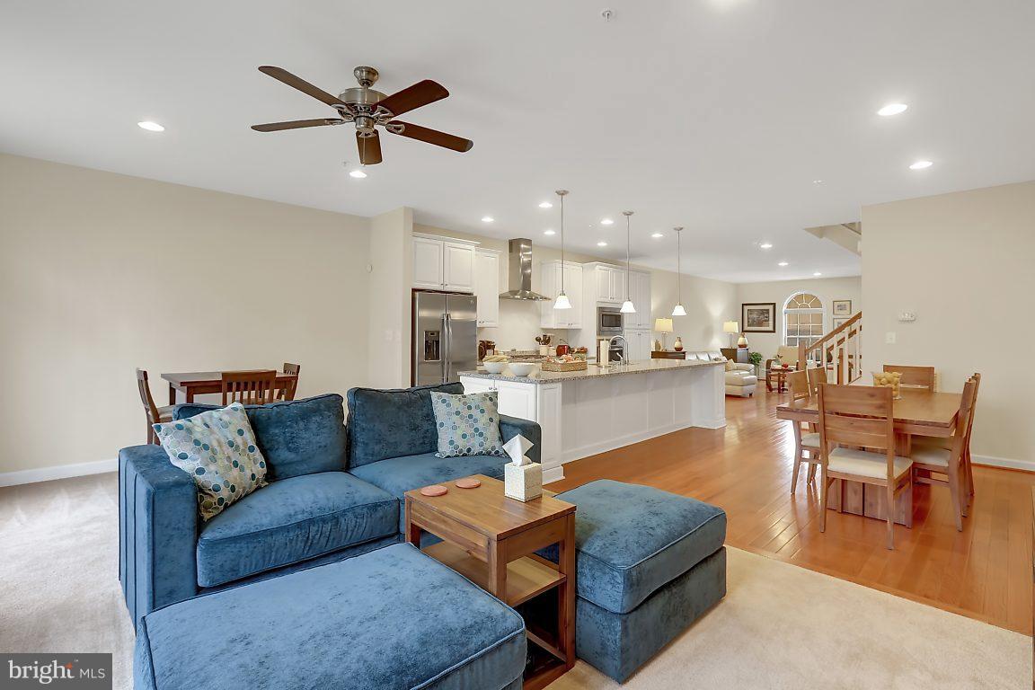 7872 Patterson Way Hanover, MD 21076 - Photo 11 of 26 a living room with furniture and kitchen view