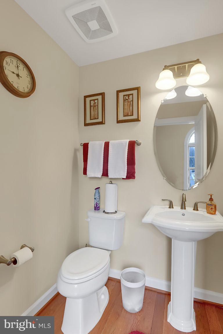 7872 Patterson Way Hanover, MD 21076 - Photo 15 of 26 a bathroom with a toilet sink and mirror