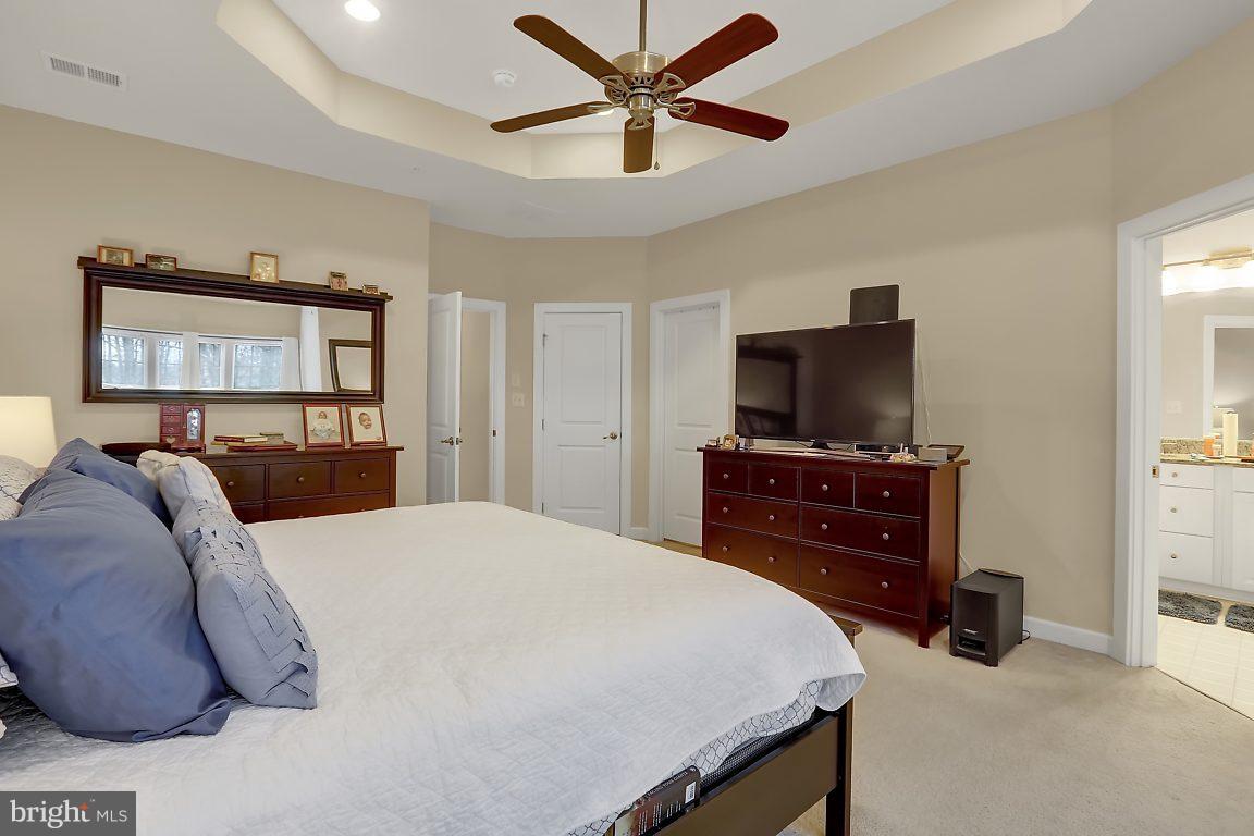 7872 Patterson Way Hanover, MD 21076 - Photo 17 of 26 a bedroom with a bed and a flat screen tv