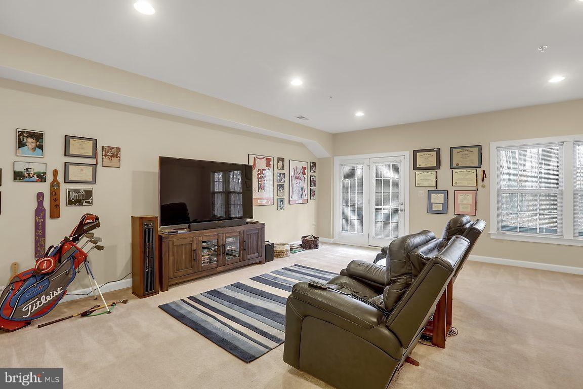 7872 Patterson Way Hanover, MD 21076 - Photo 3 of 26 a living room with furniture and a flat screen tv