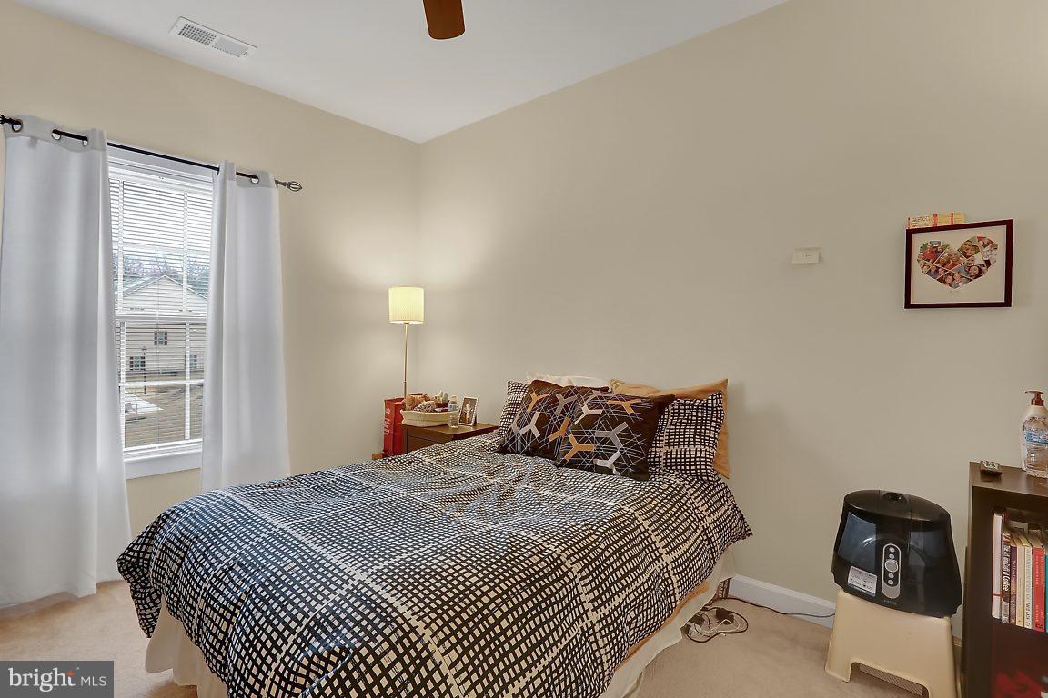 7872 Patterson Way Hanover, MD 21076 - Photo 21 of 26 a bedroom with a bed and a window