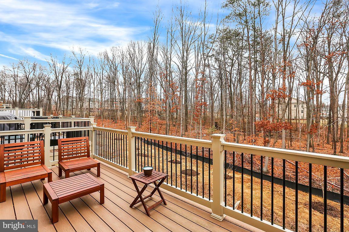 7872 Patterson Way Hanover, MD 21076 - Photo 24 of 26 a view of a chairs and table on the wooden floor