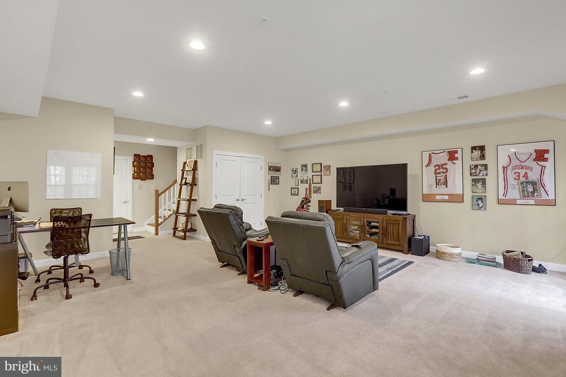 7872 Patterson Way Hanover, MD 21076 - Photo 4 of 26 a living room with furniture and a flat screen tv