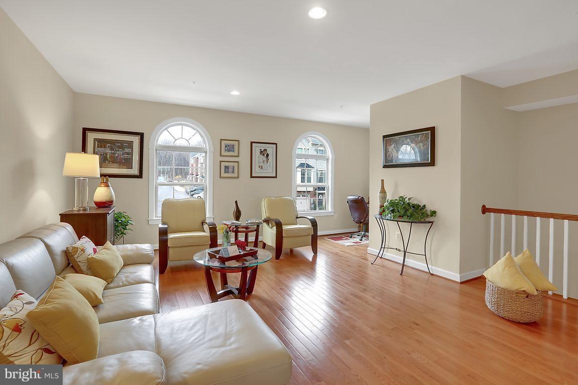 7872 Patterson Way Hanover, MD 21076 - Photo 6 of 26 a living room with furniture and wooden floor