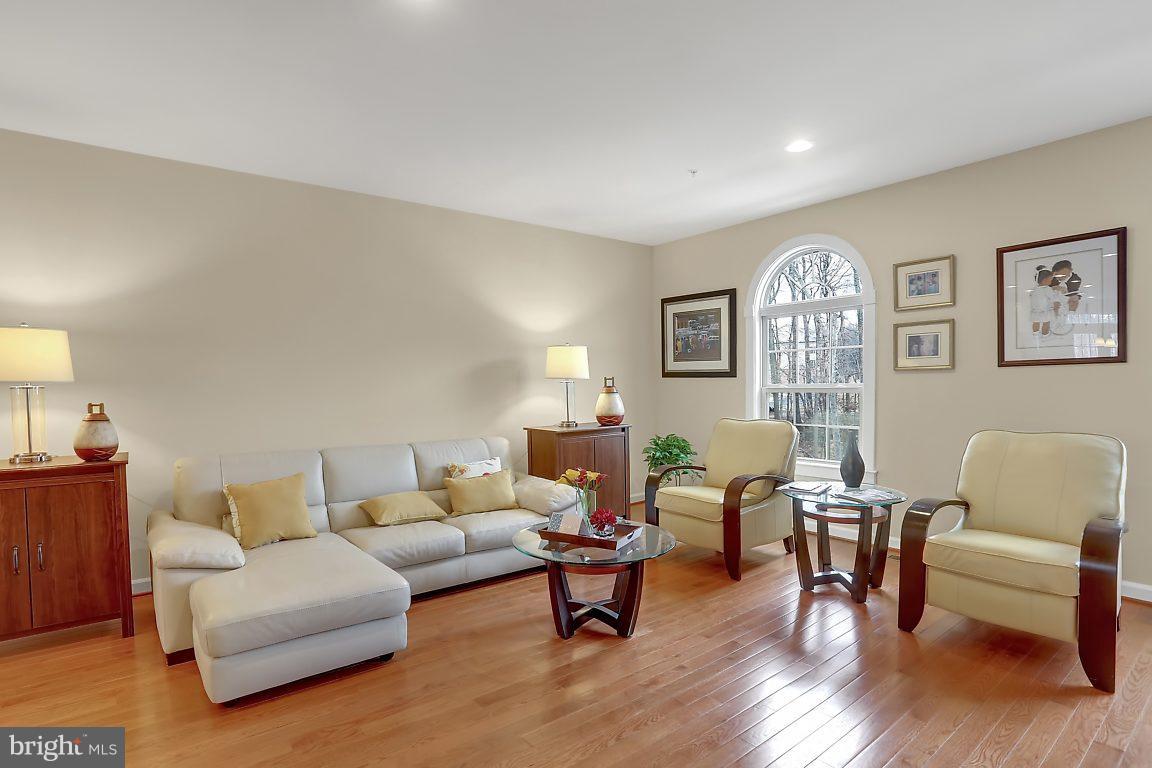7872 Patterson Way Hanover, MD 21076 - Photo 7 of 26 a living room with furniture and wooden floor