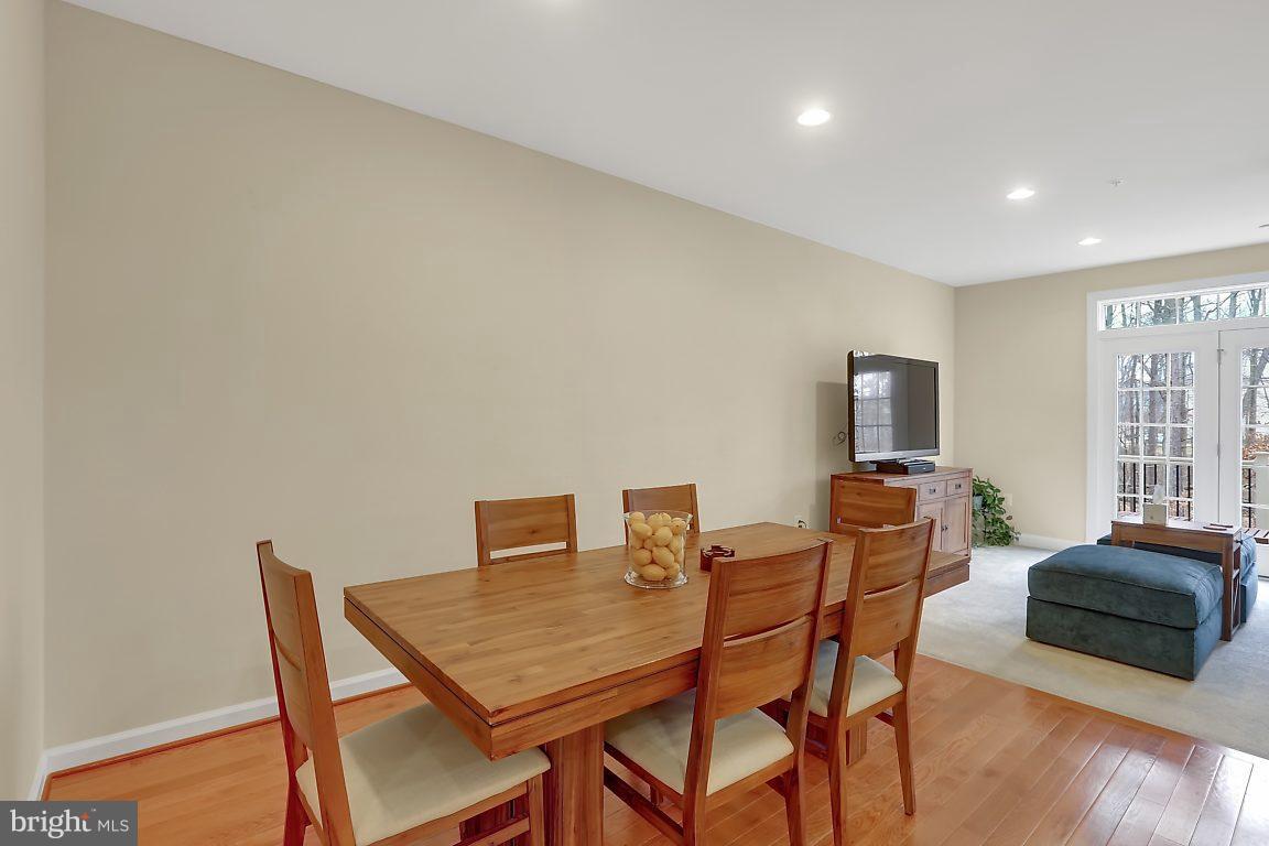 7872 Patterson Way Hanover, MD 21076 - Photo 9 of 26 a view of a dining room with furniture and wooden floor