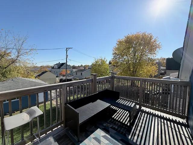 a view of balcony with furniture