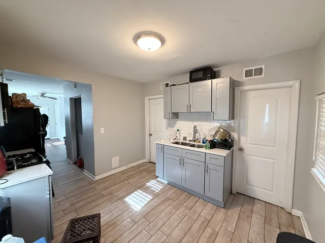 a kitchen with stainless steel appliances granite countertop a stove and a refrigerator