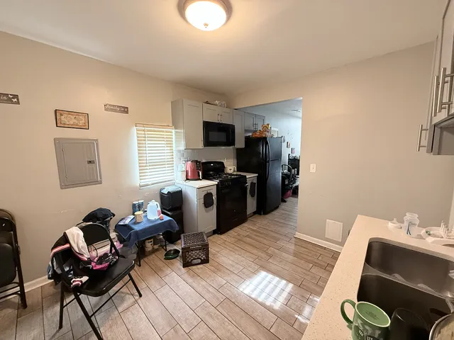 a room with furniture a rug and a window