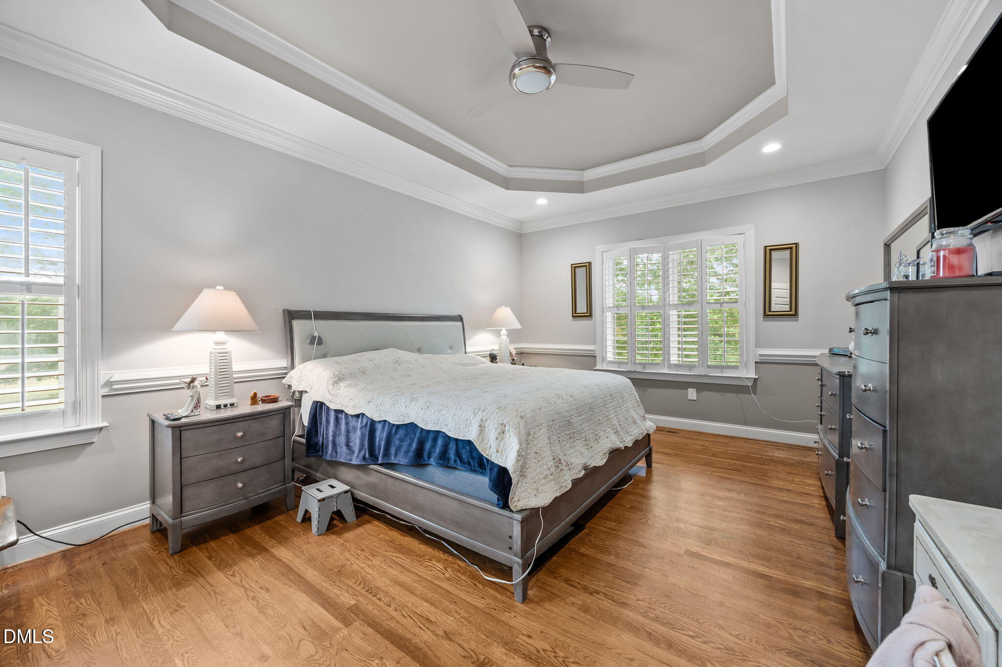 2880 Elevation Road Four Oaks, NC 27524 - Photo 25 of 51 a spacious bedroom with a bed flat screen tv and a large window