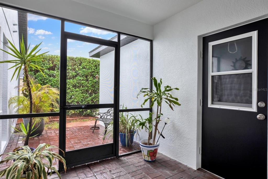 2021 Meadow Rue Court Trinity, FL 34655 - Photo 26 of 41 a view of a porch with a potted plant