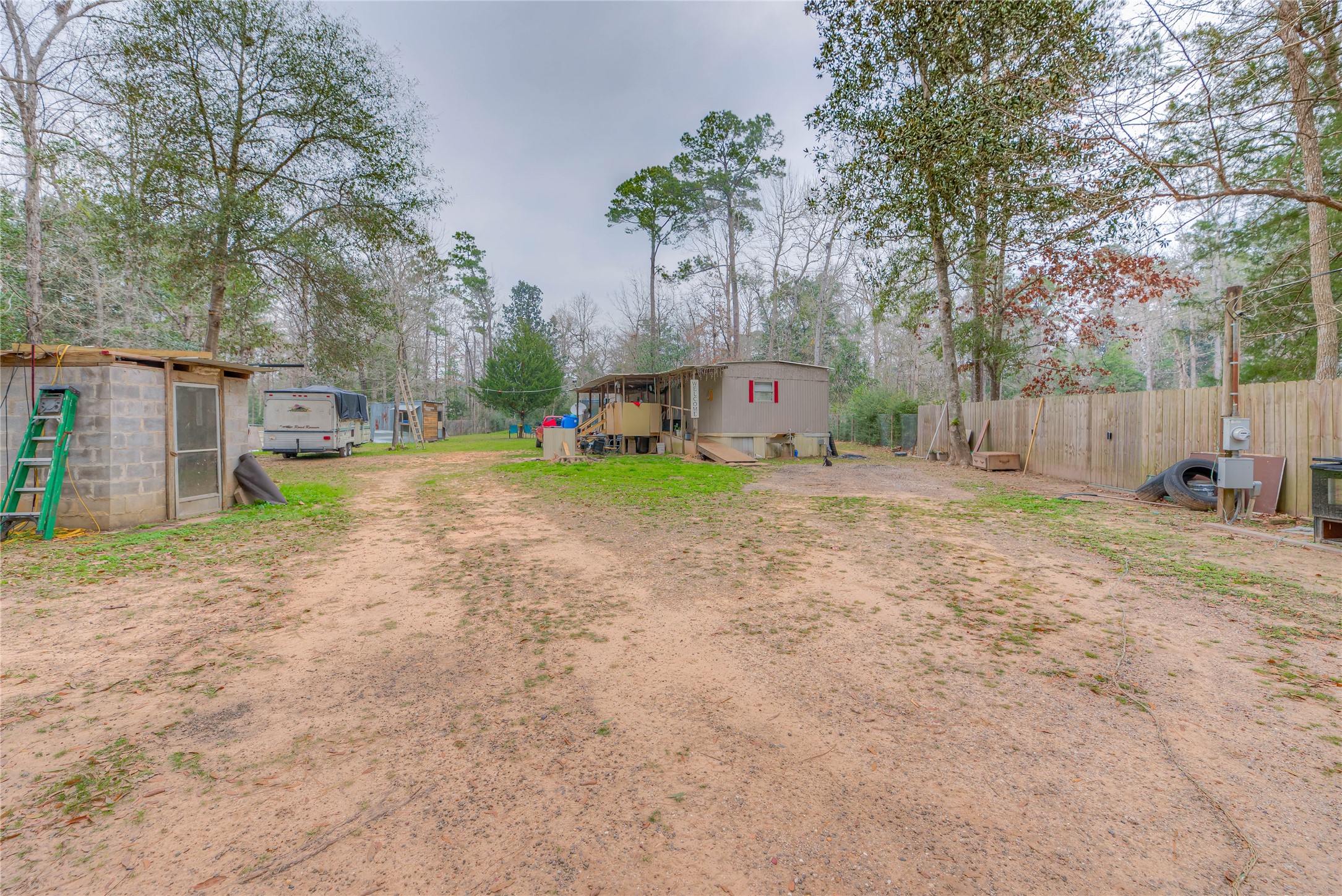 713 Garrett Road Livingston, TX 77351 - Photo 26 of 40 a view of a yard with swimming pool