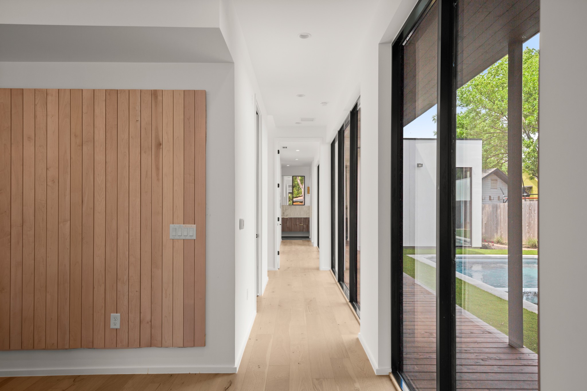 1805 Collier Street Austin, TX 78704 - Photo 11 of 40 a view of a hallway with wooden floor and windows