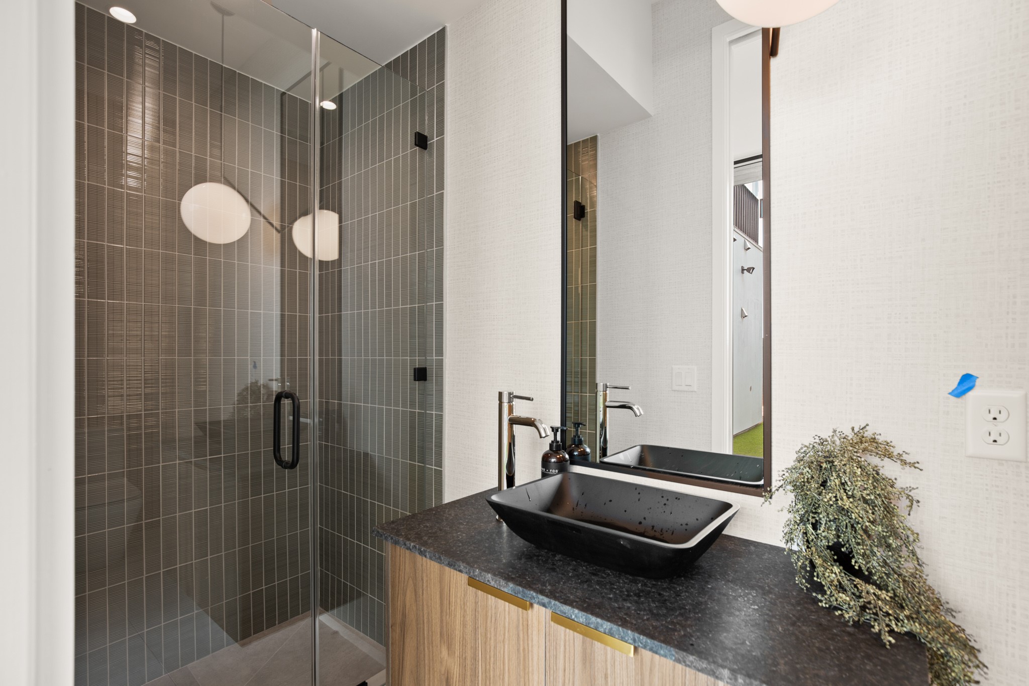 1805 Collier Street Austin, TX 78704 - Photo 12 of 40 a bathroom with a granite countertop sink and a mirror