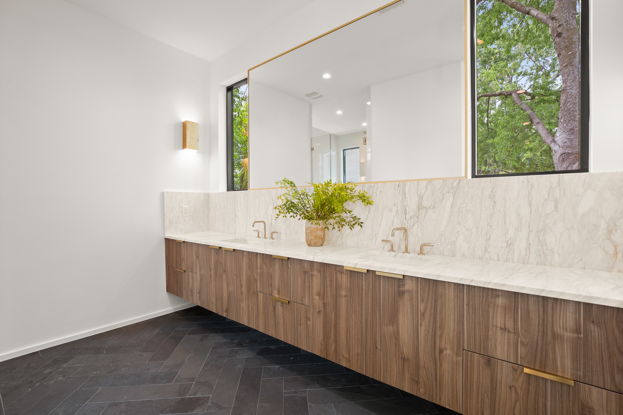 1805 Collier Street Austin, TX 78704 - Photo 17 of 40 a bathroom with a double vanity sink and a large mirror